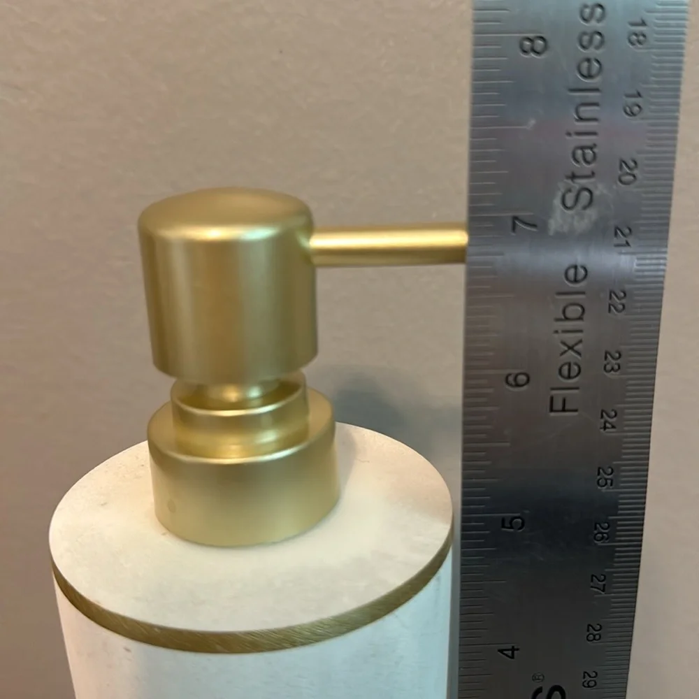 7” lotion/soap dispenser. Marble-like finish with gold accents. Ceramic/metal